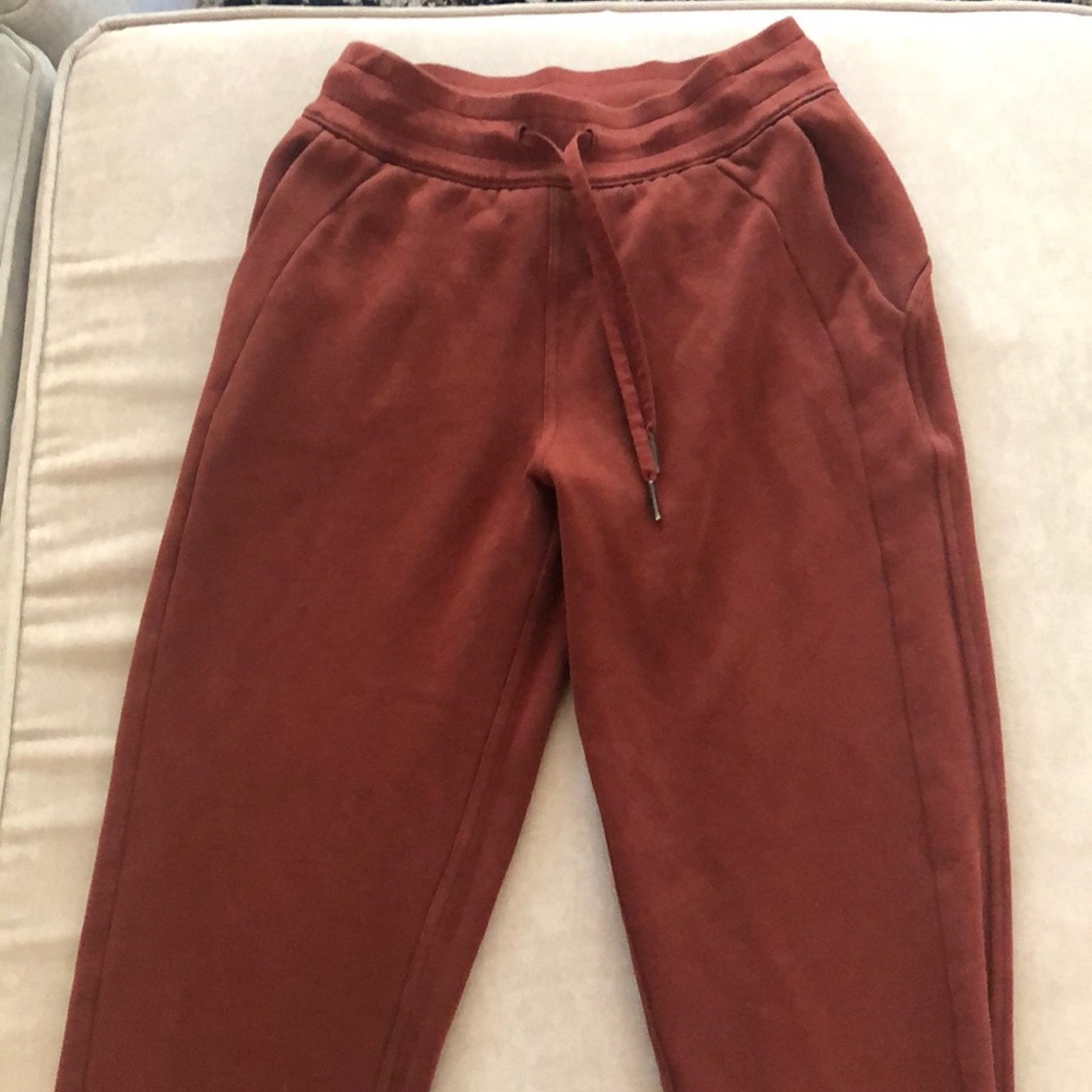 Grew out of it. Reddish brown Lululemon sweatpants. Size 4. Like new